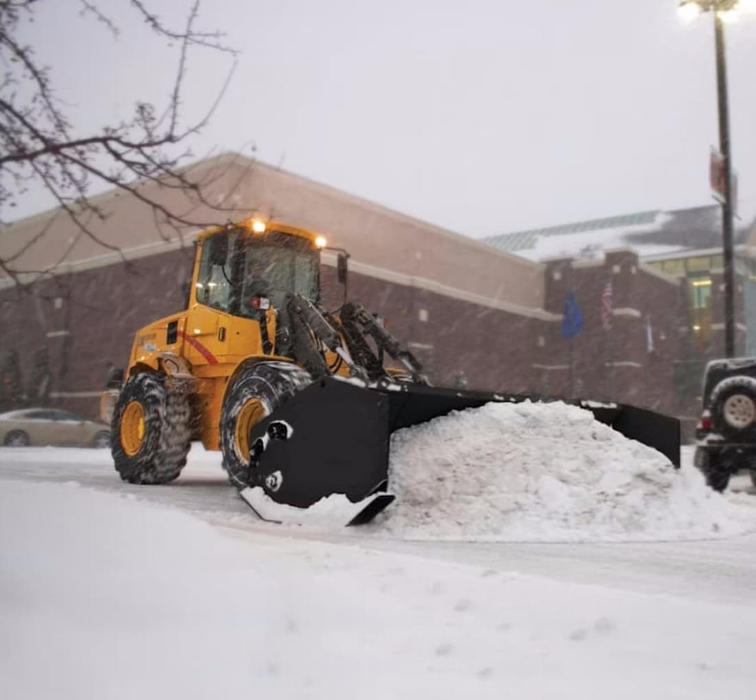 snow plowing parking lot in Oak Creek
